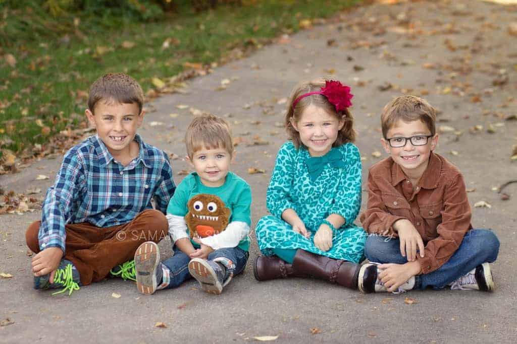 4 siblings smile 