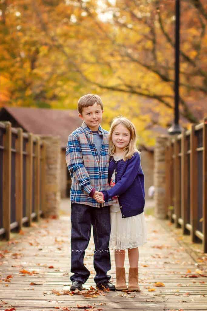 brother and sister smile at camera during photo session with samantha sinchek photography