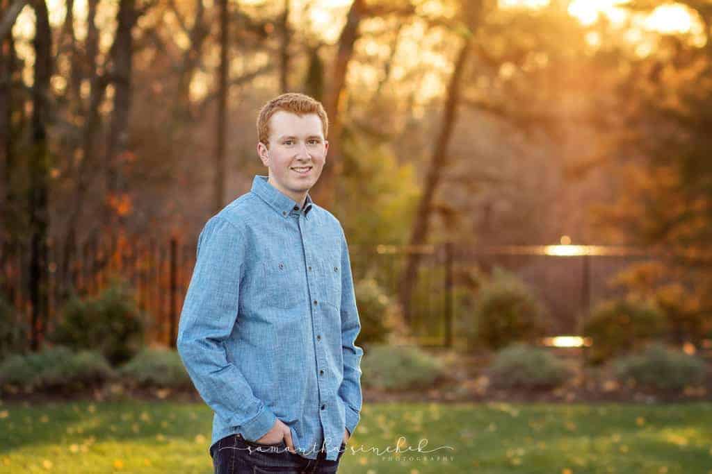 high school senior teen stands at ault park